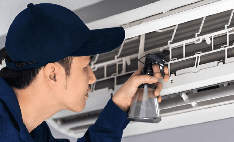 technician repairing AC